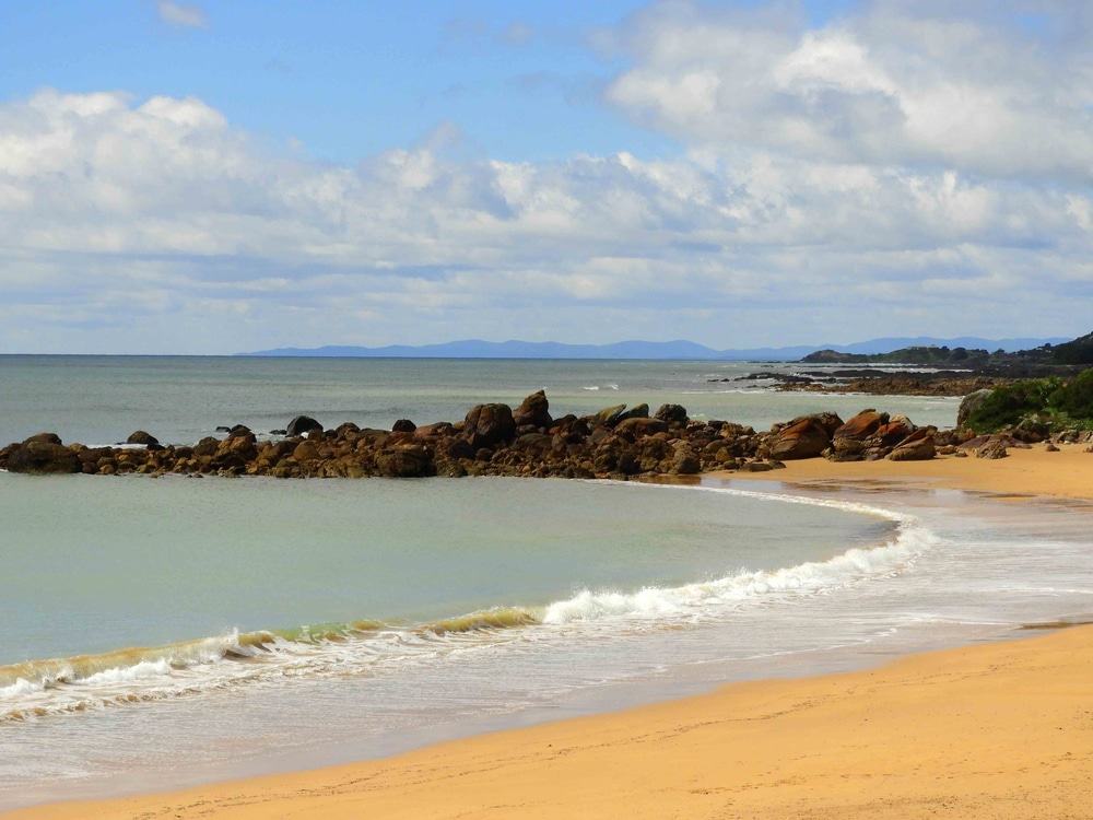 Beach in the town of penguin along the bass highway