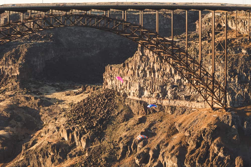 Base Jumpers Parachuting in the Snake River Canyon