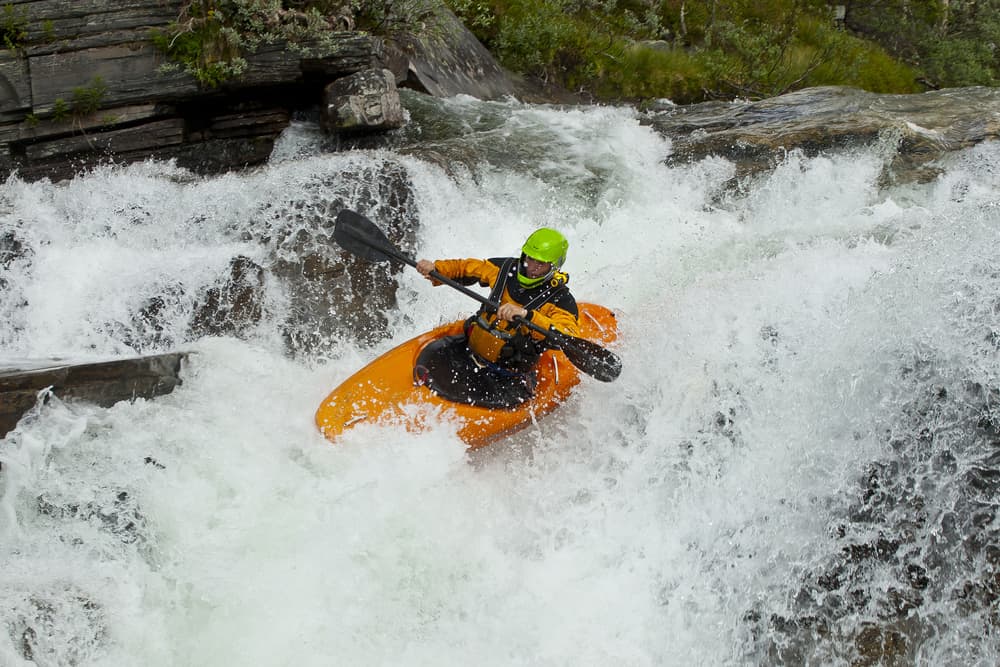 Kayaker in the Waterfall